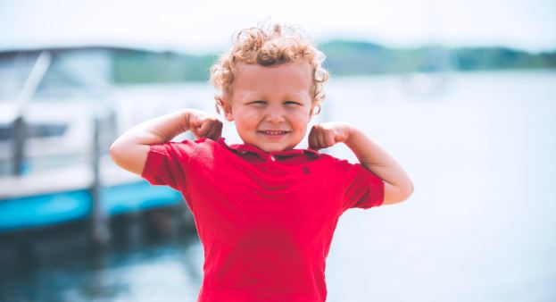 kid flexing muscles